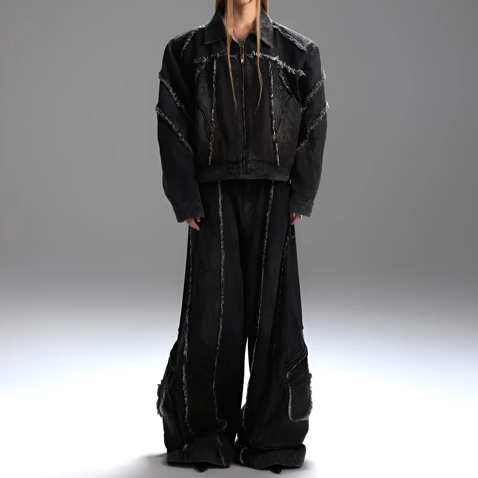 Black distressed denim coat and pants set with padded shoulders and gradient dye pattern