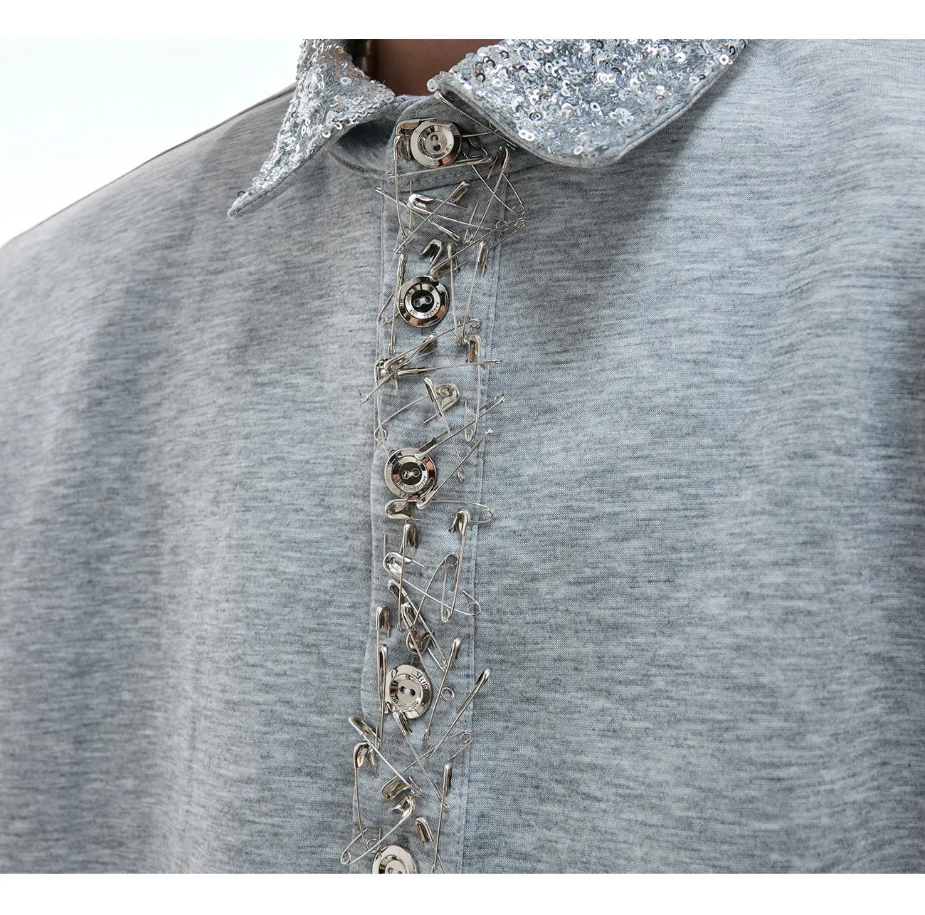Loose fit square neck short sleeved shirt with sequin decoration in black, grey, or white.
