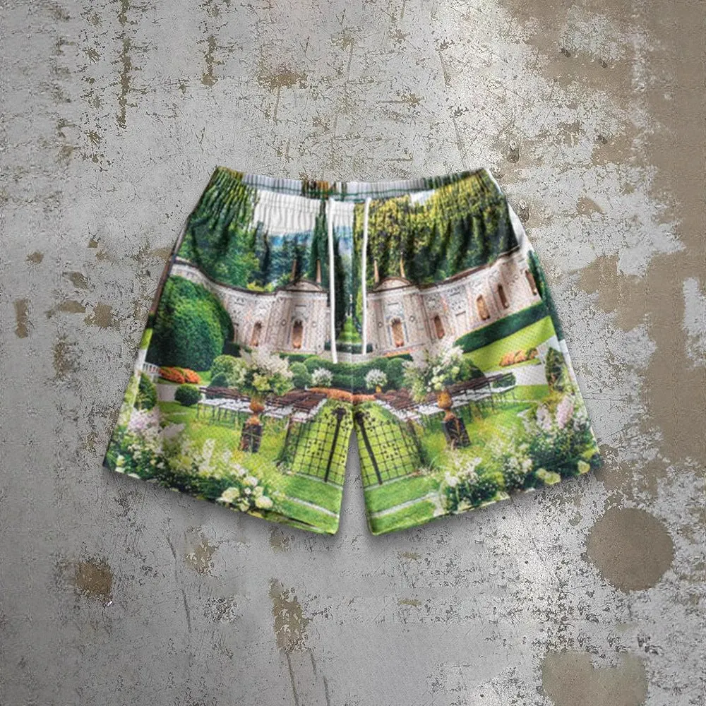 Man wearing loose blue digital print beach shorts made from quick-dry milk silk polyester fabric.