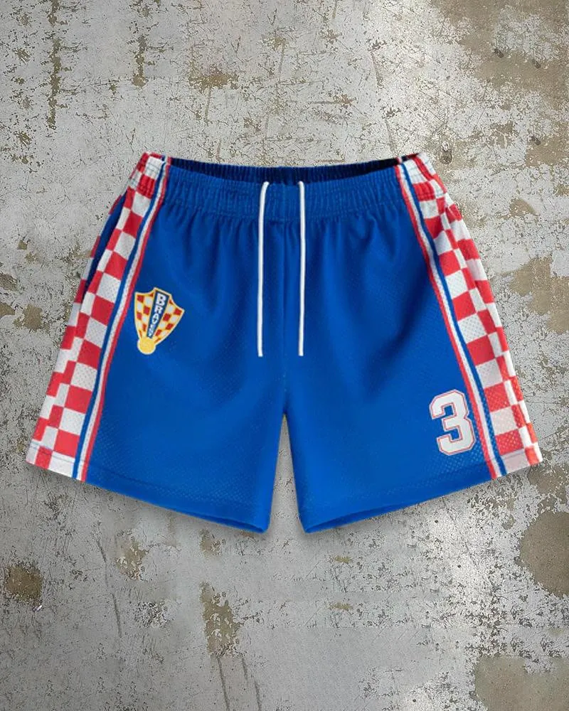 Man wearing loose blue digital print beach shorts made from quick-dry milk silk polyester fabric.
