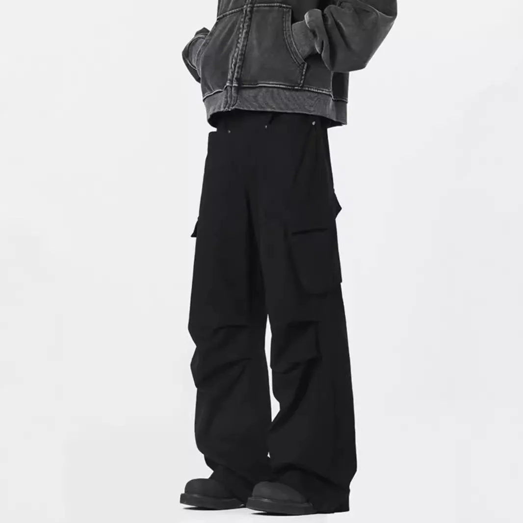 Man wearing retro style high-waisted straight leg casual trousers in black.