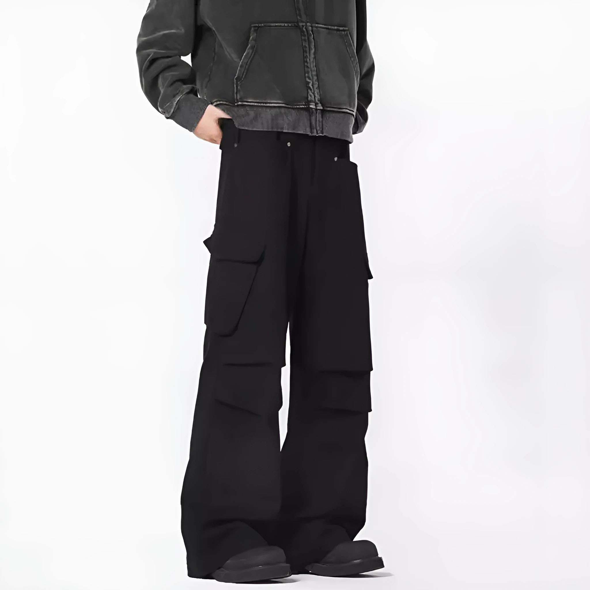 Man wearing retro style high-waisted straight leg casual trousers in black.