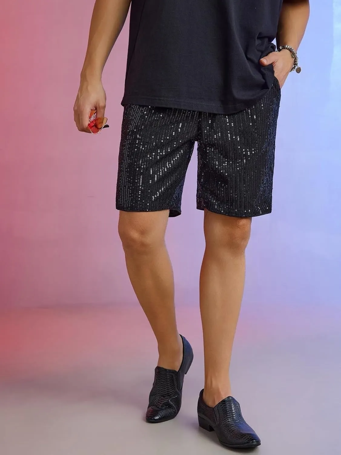 Men's silver sequin straight-leg shorts with elastic waistband, shown alongside black colour option.