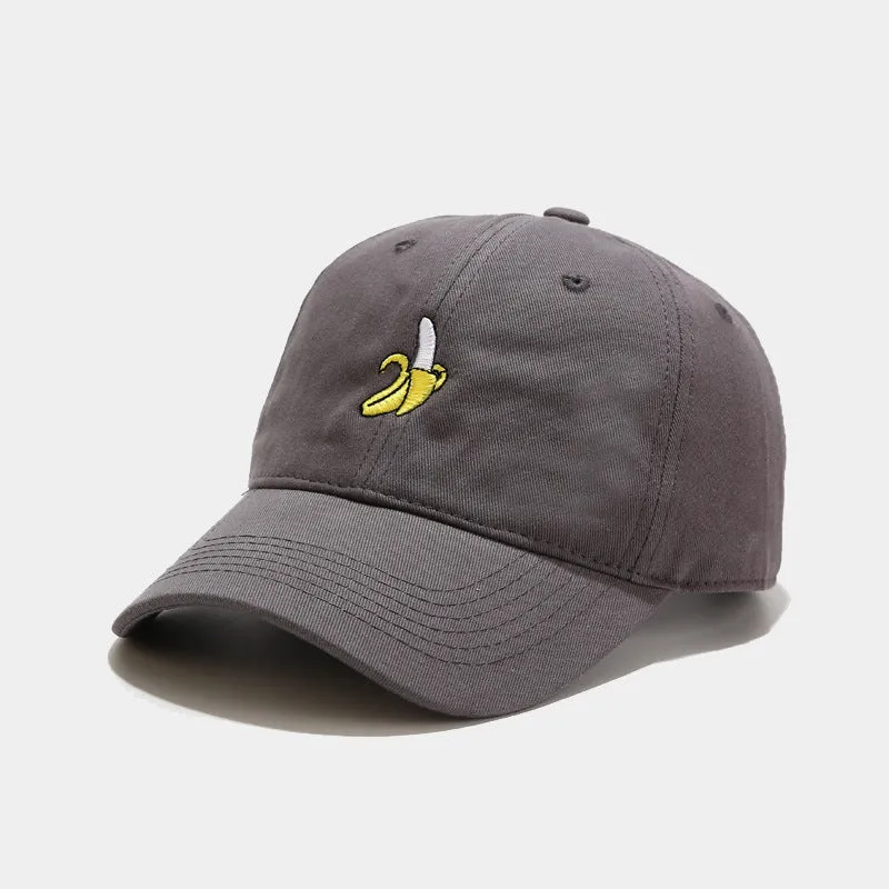 Curved peak baseball cap with embroidered banana fruit design in light purple colour on a white background.