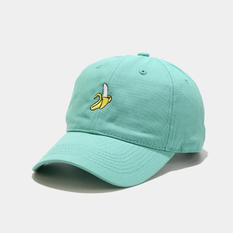 Curved peak baseball cap with embroidered banana fruit design in light purple colour on a white background.