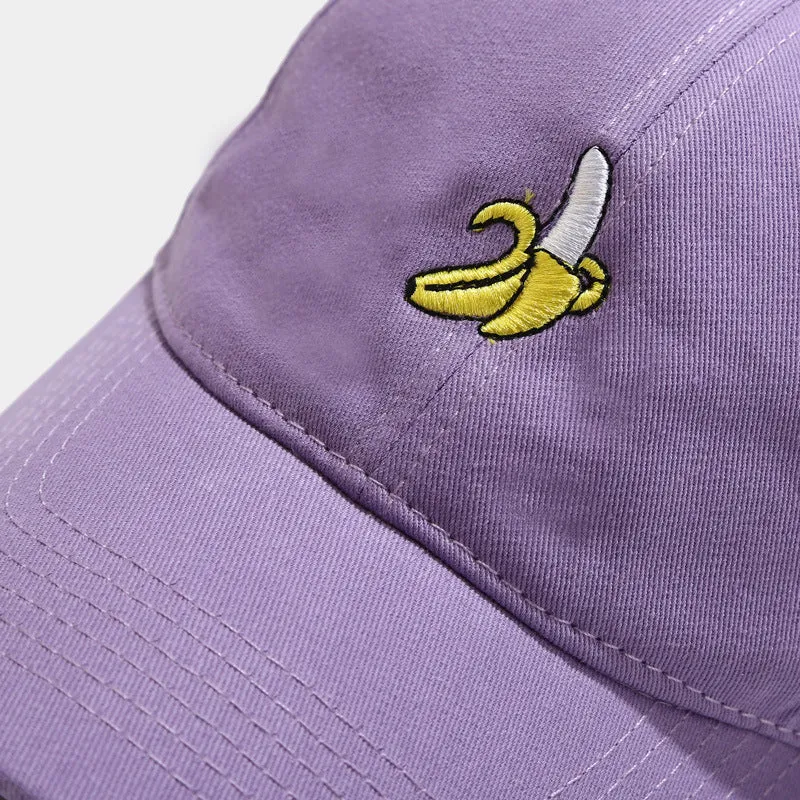 Curved peak baseball cap with embroidered banana fruit design in light purple colour on a white background.