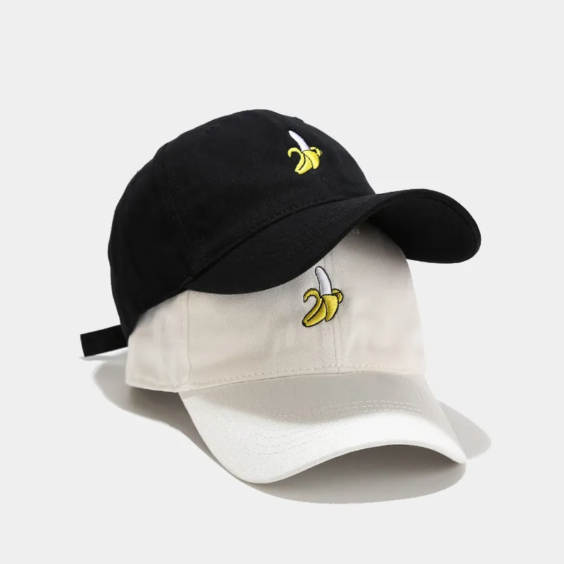 Curved peak baseball cap with embroidered banana fruit design in light purple colour on a white background.