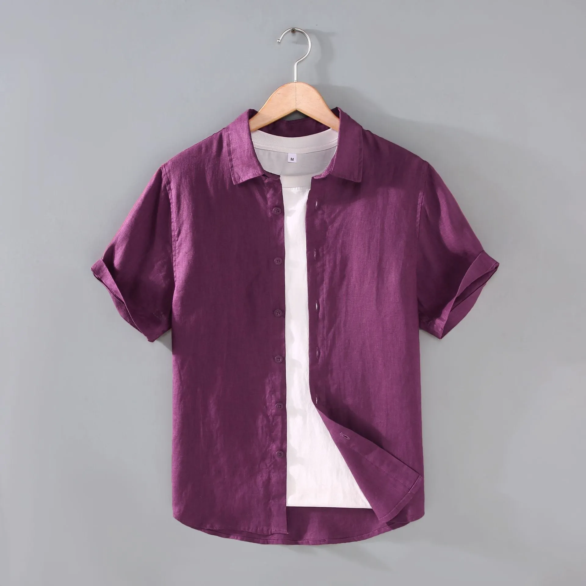 Men's casual short-sleeved linen shirt in regular fit showing colour options including apricot, dark blue, and gray