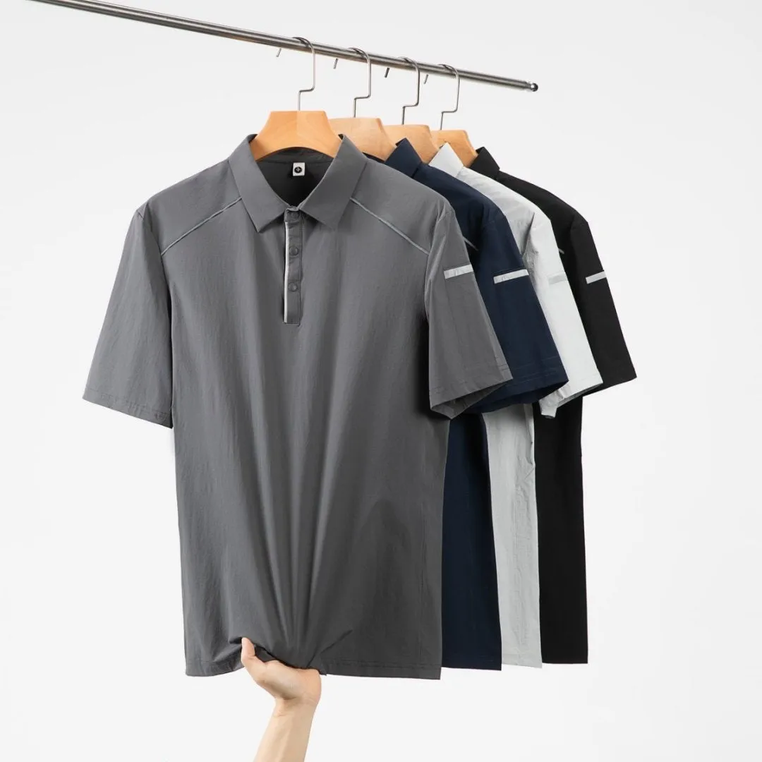 Man wearing a navy blue nylon business T-shirt with a stand collar and colour stitching detail.