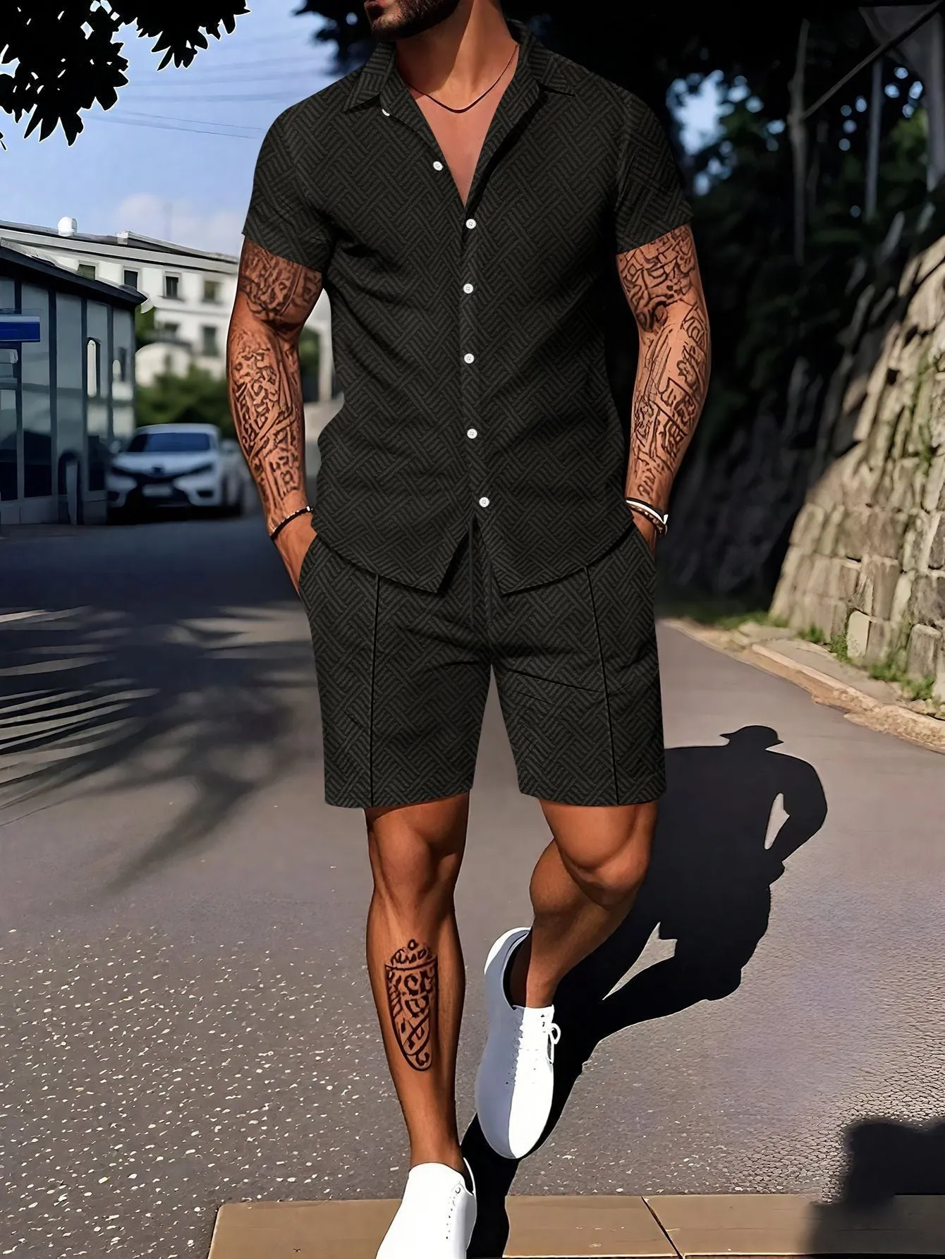 Man wearing a digital print short sleeve top and matching shorts from a casual suit set.