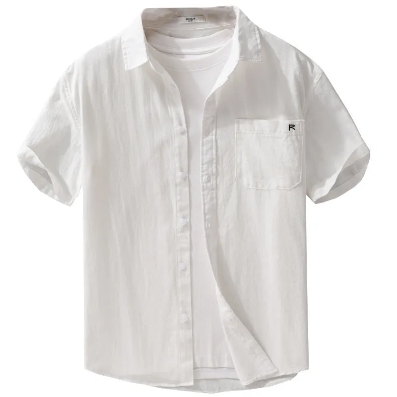 Men's light blue loose fit short-sleeved cotton shirt with a cardigan style front, laid flat.