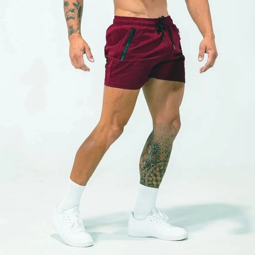 Man wearing mid-waist blue casual sports shorts made from quick-dry polyester fabric.