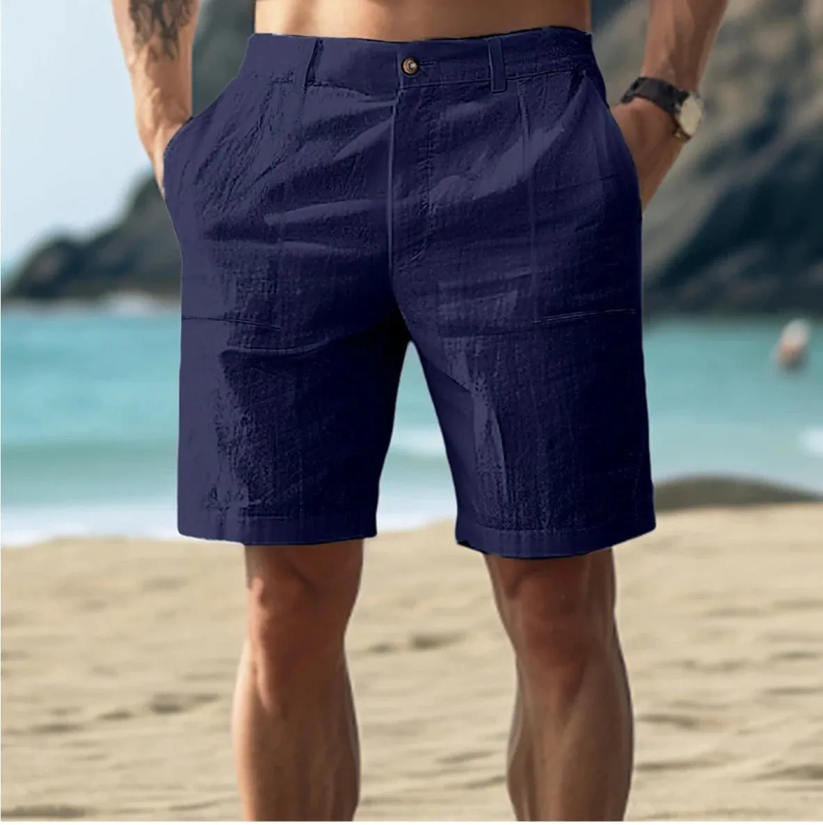 Men's mid-length cotton casual pants in dark blue with a button-fly front.