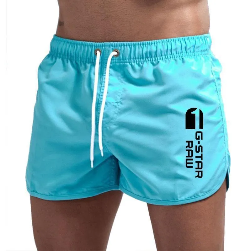 Men's thin polyester hemp-blend beach shorts in various colours with micro-elastic waistband for sports