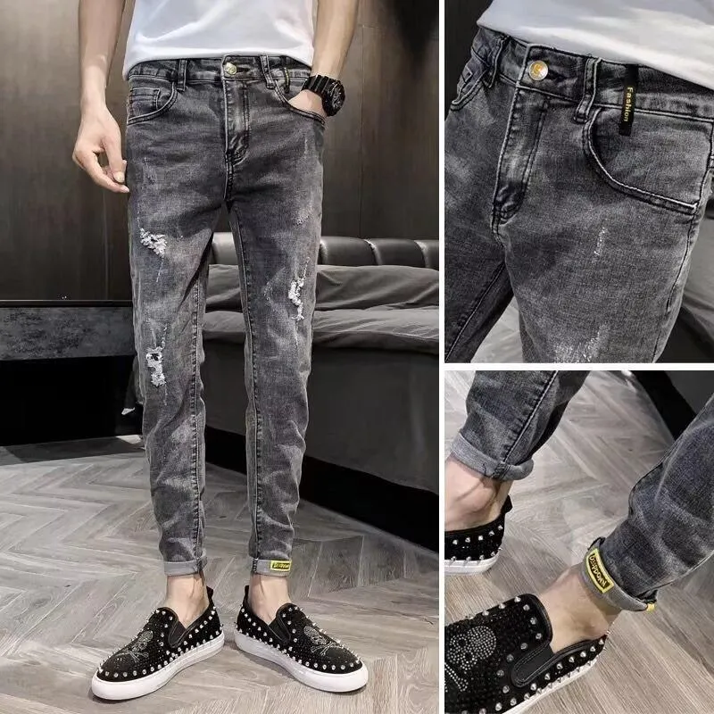 Men's high waist blue jeans with a five-pocket design and button fly on a mannequin.