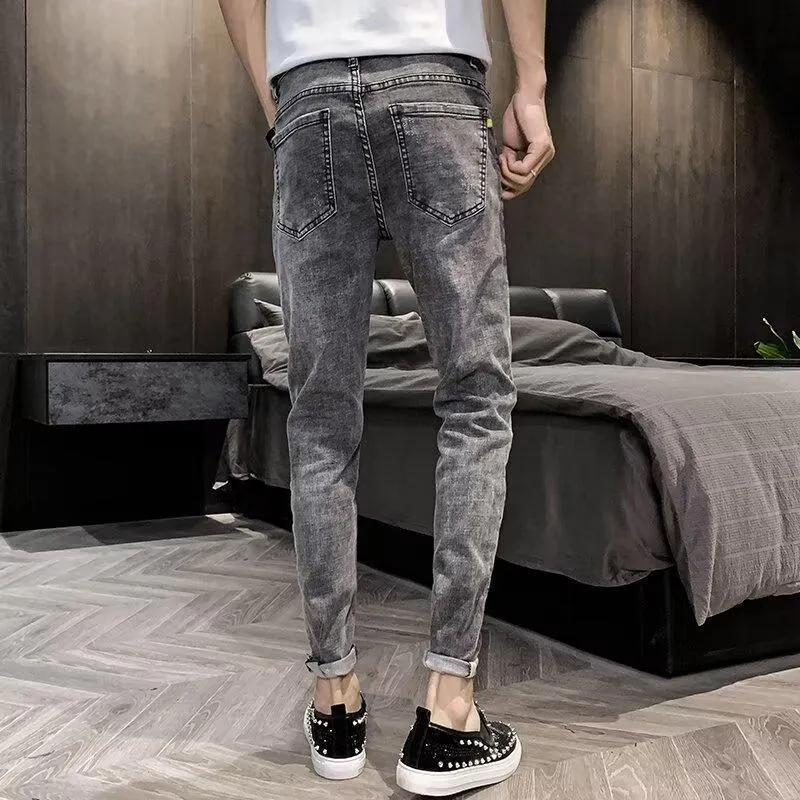 Men's high waist blue jeans with a five-pocket design and button fly on a mannequin.