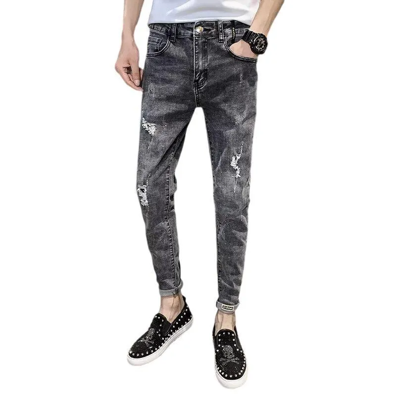 Men's high waist blue jeans with a five-pocket design and button fly on a mannequin.