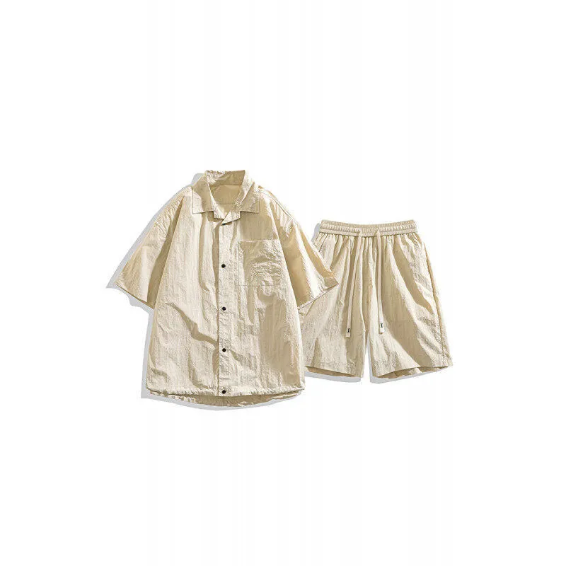 Man wearing a loose dark grey hemp-blend casual shirt with matching shorts from a two-piece set.