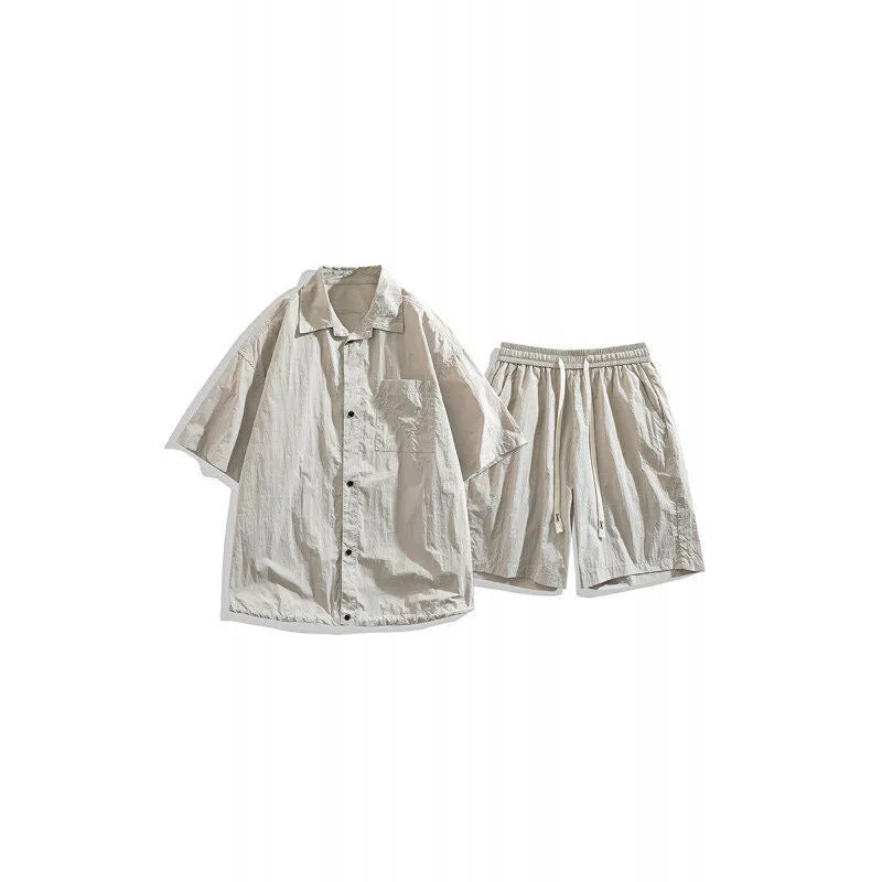 Man wearing a loose dark grey hemp-blend casual shirt with matching shorts from a two-piece set.