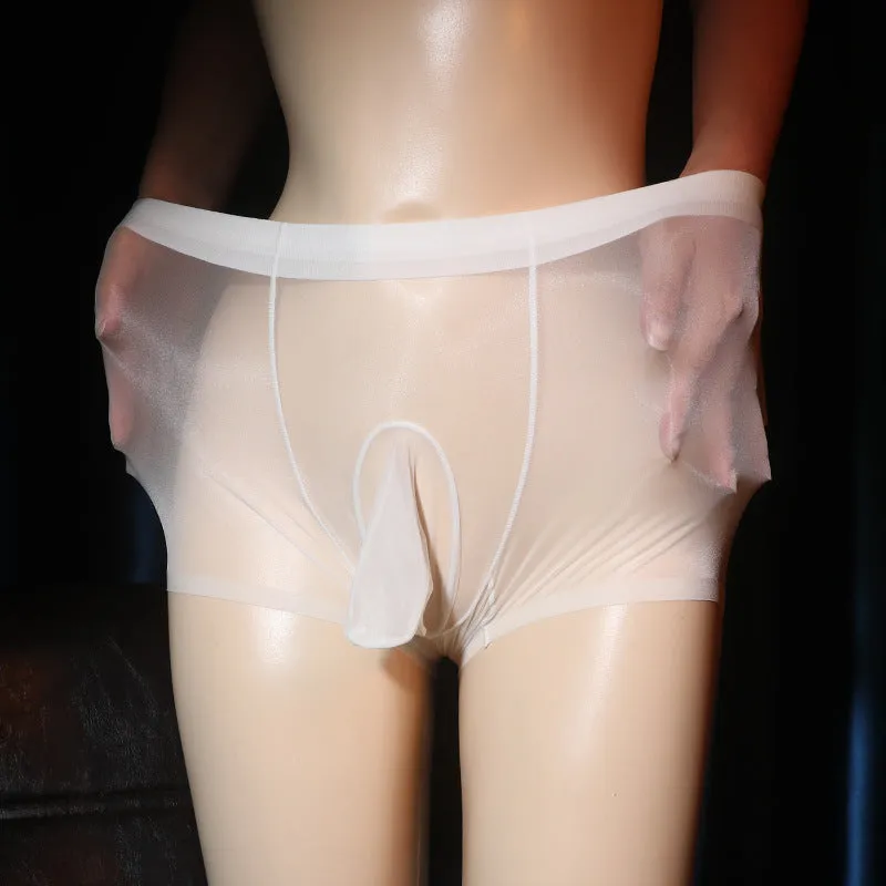 Plus size transparent nylon underwear shorts in skin colour on a hanger, showing seamless mid-waist design.