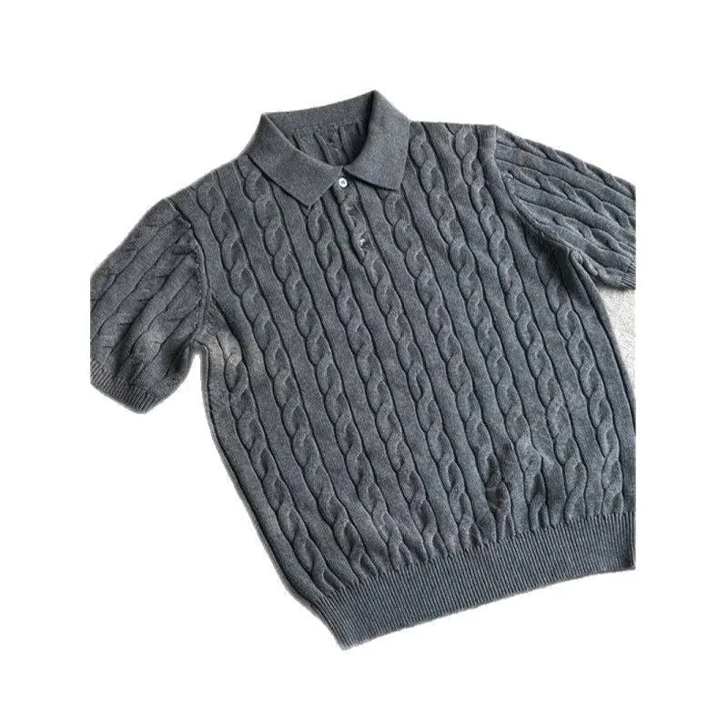 Man wearing a gray knitted short sleeve crew neck t-shirt, casual summer outfit.