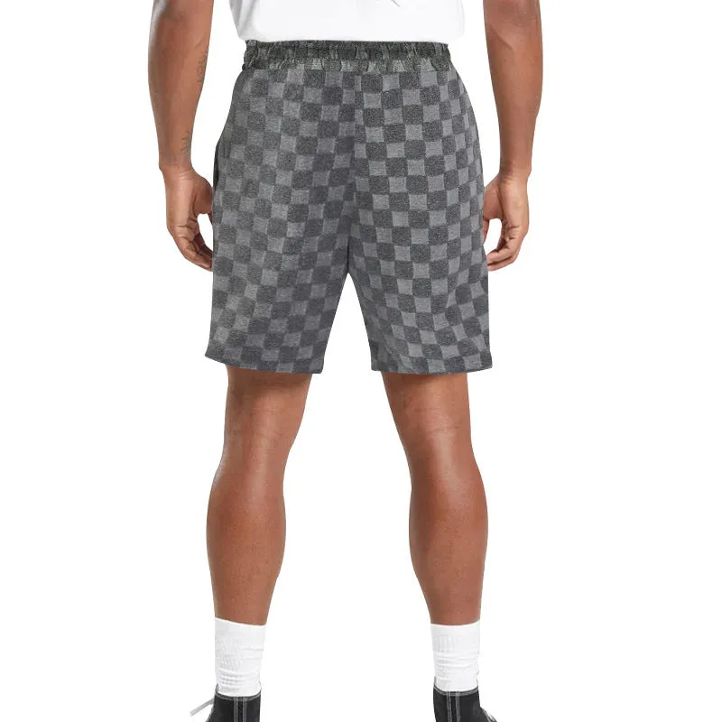 Men's black and white checkerboard plaid loose sports shorts with an elastic waistband.