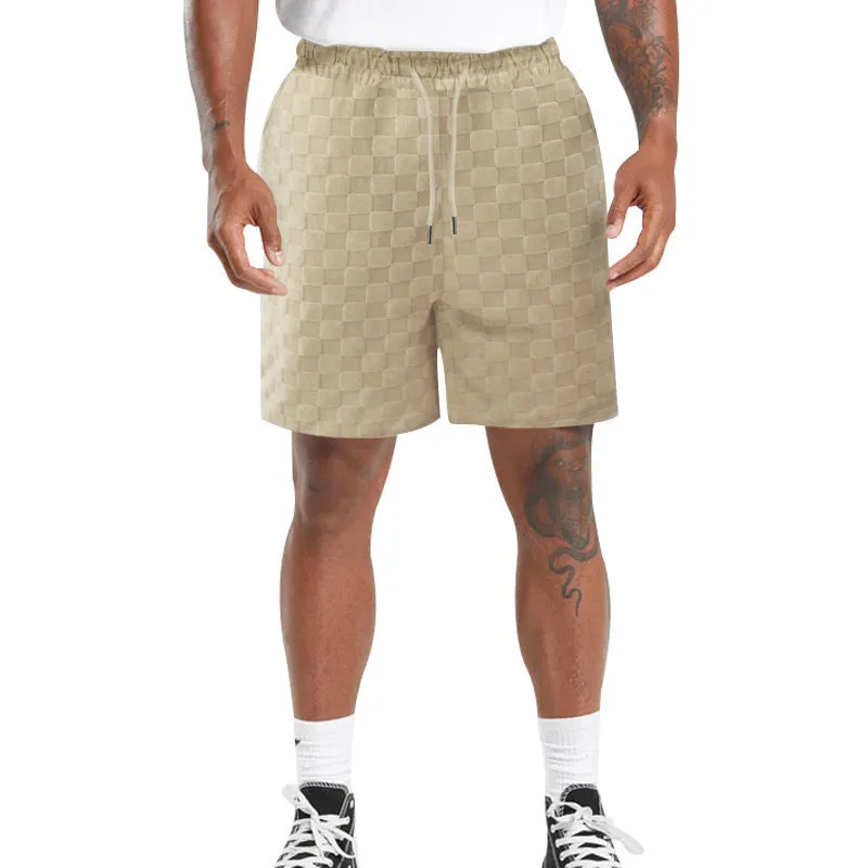 Men's black and white checkerboard plaid loose sports shorts with an elastic waistband.