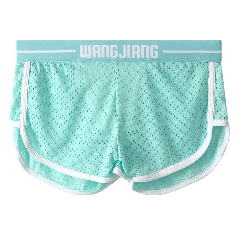 Men's solid colour Ice Silk nylon boxer shorts with a loose fit on a white background