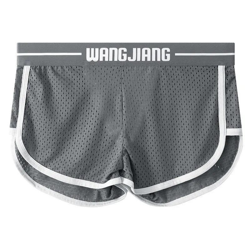Men's solid colour Ice Silk nylon boxer shorts with a loose fit on a white background