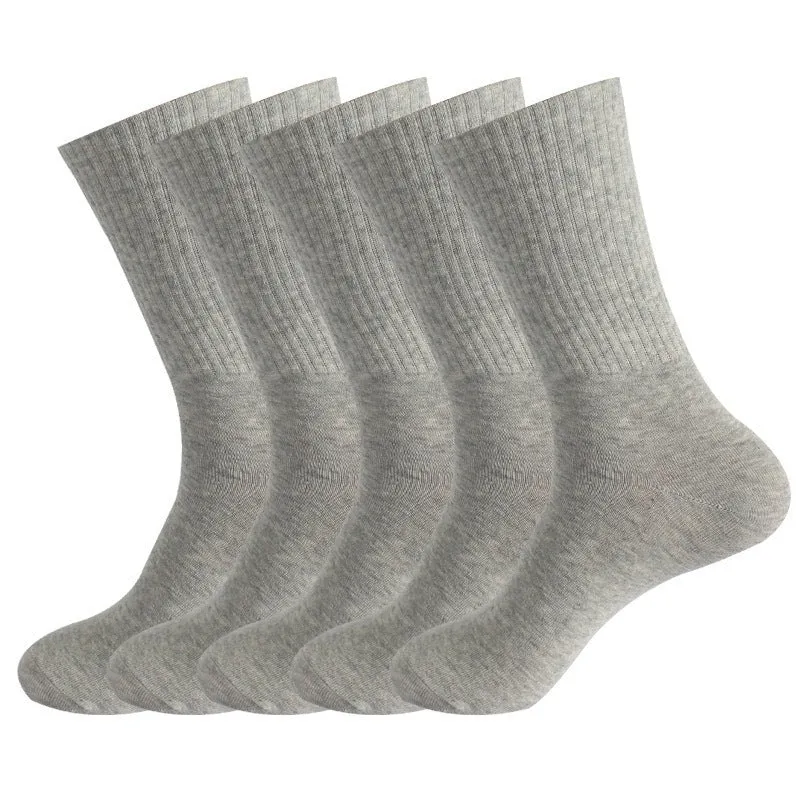 Mid-calf length sports socks in black, white, and grey colours