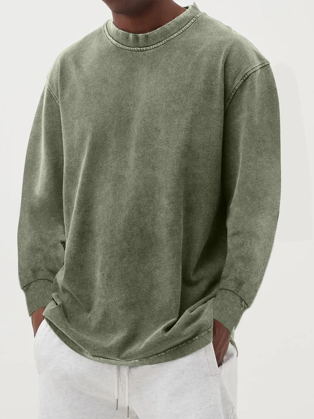 Man wearing a slim fit long sleeve t-shirt in a solid colour, with options in sky blue, green, gray, black, and camel.