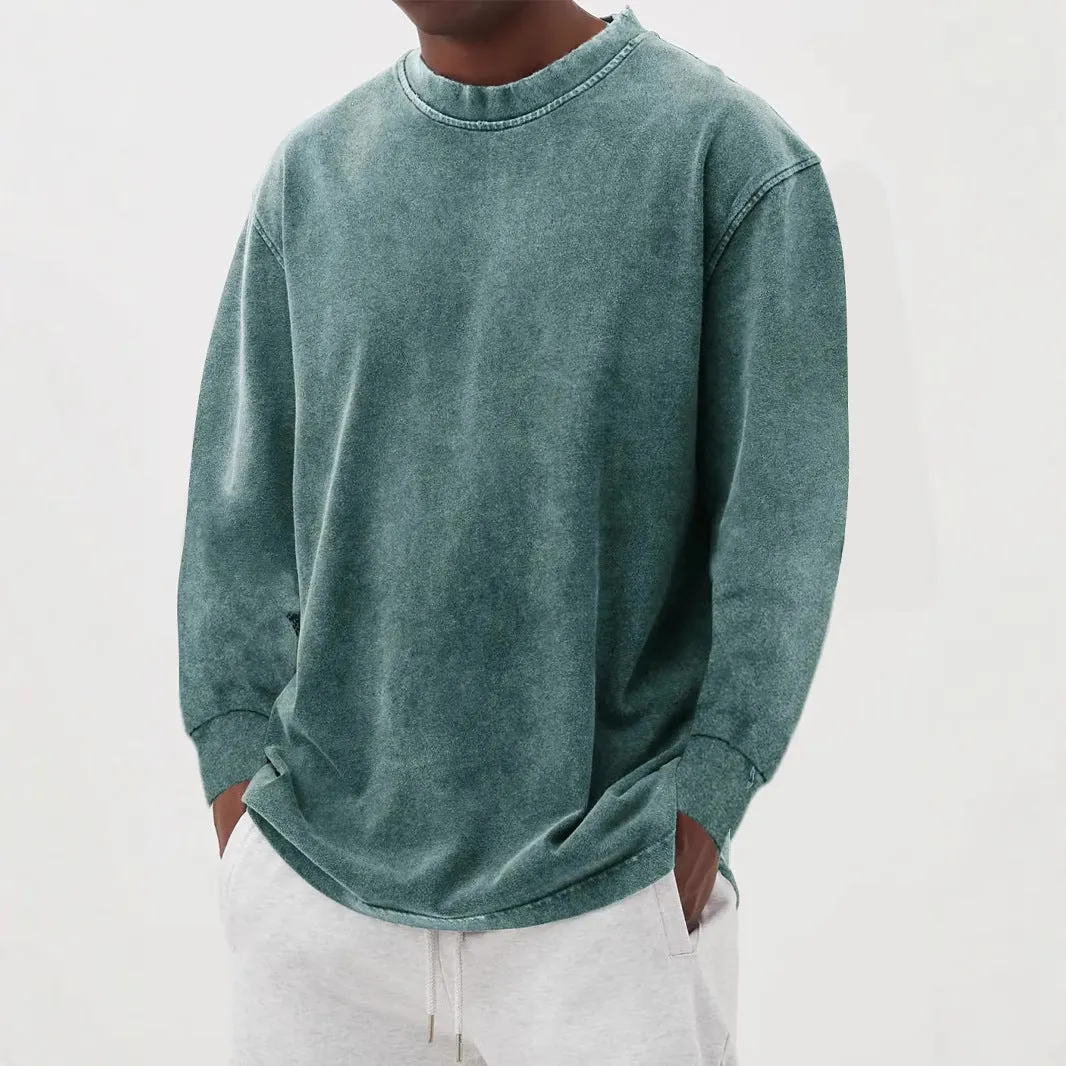 Man wearing a slim fit long sleeve t-shirt in a solid colour, with options in sky blue, green, gray, black, and camel.