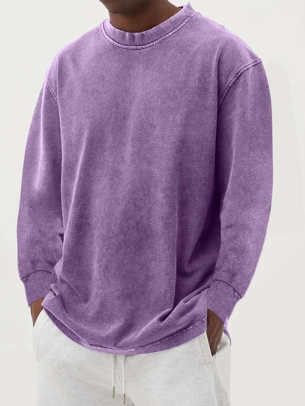 Man wearing a slim fit long sleeve t-shirt in a solid colour, with options in sky blue, green, gray, black, and camel.