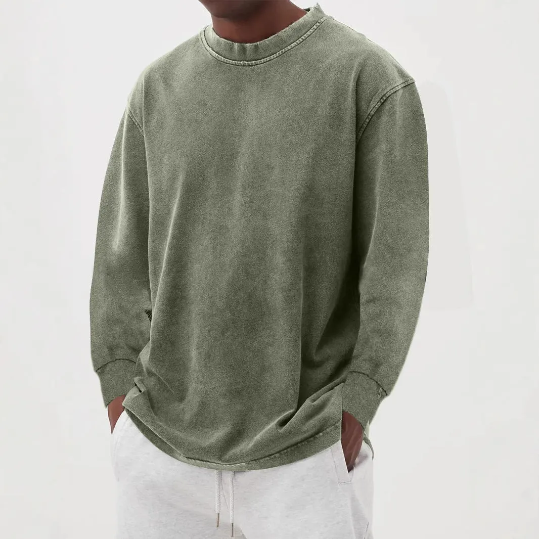 Man wearing a slim fit long sleeve t-shirt in a solid colour, with options in sky blue, green, gray, black, and camel.