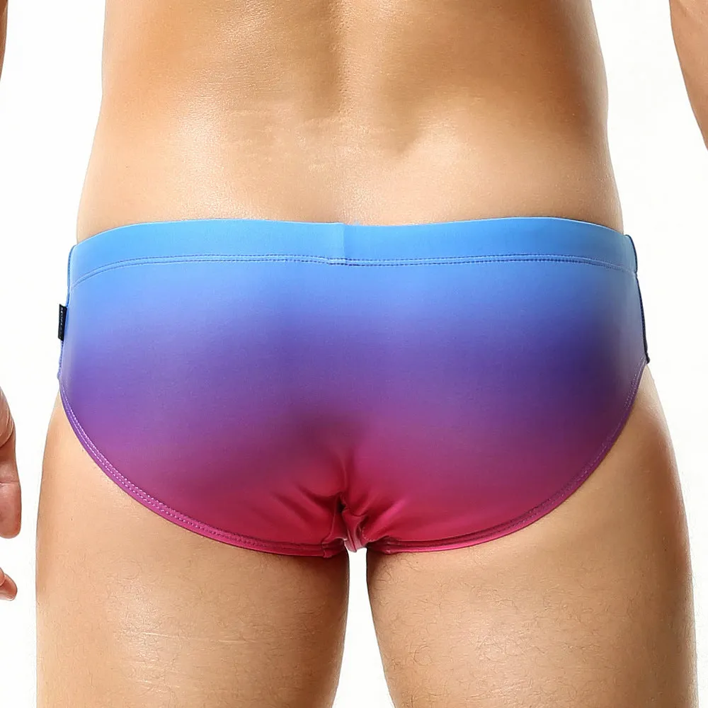 Men's solid colour polyester swim trunks in briefs style for swimming.