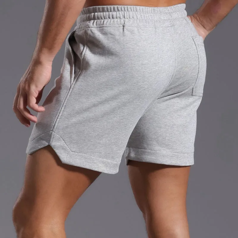Men's below-the-knee cotton workout capris in charcoal grey with mid-waist design