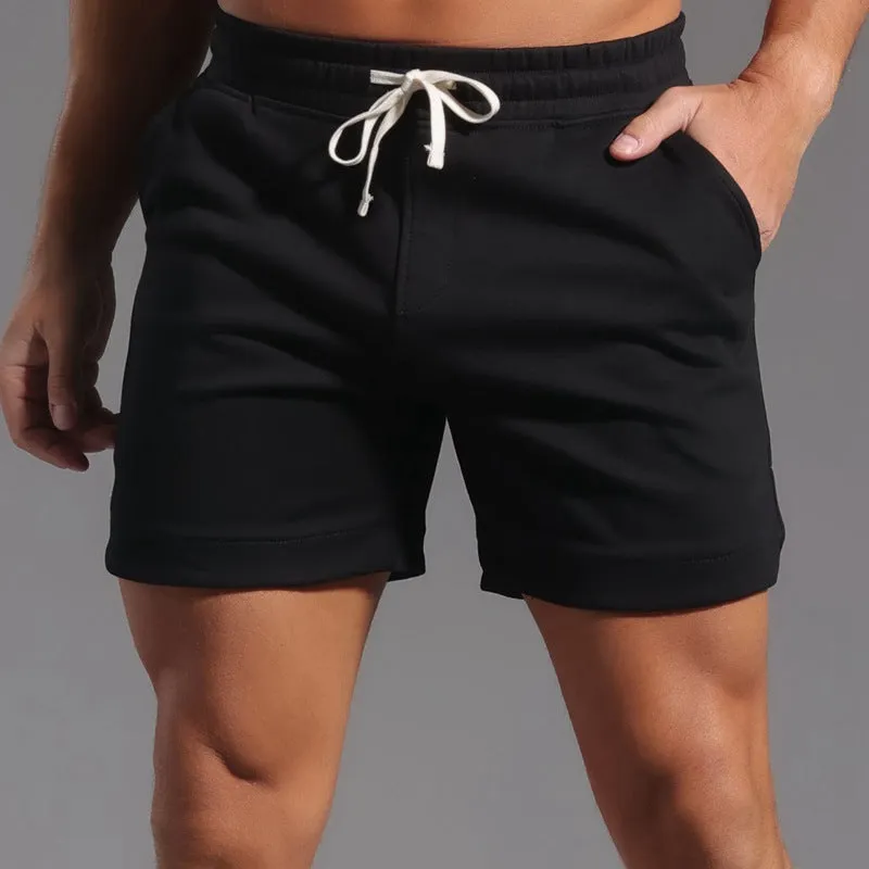 Men's below-the-knee cotton workout capris in charcoal grey with mid-waist design