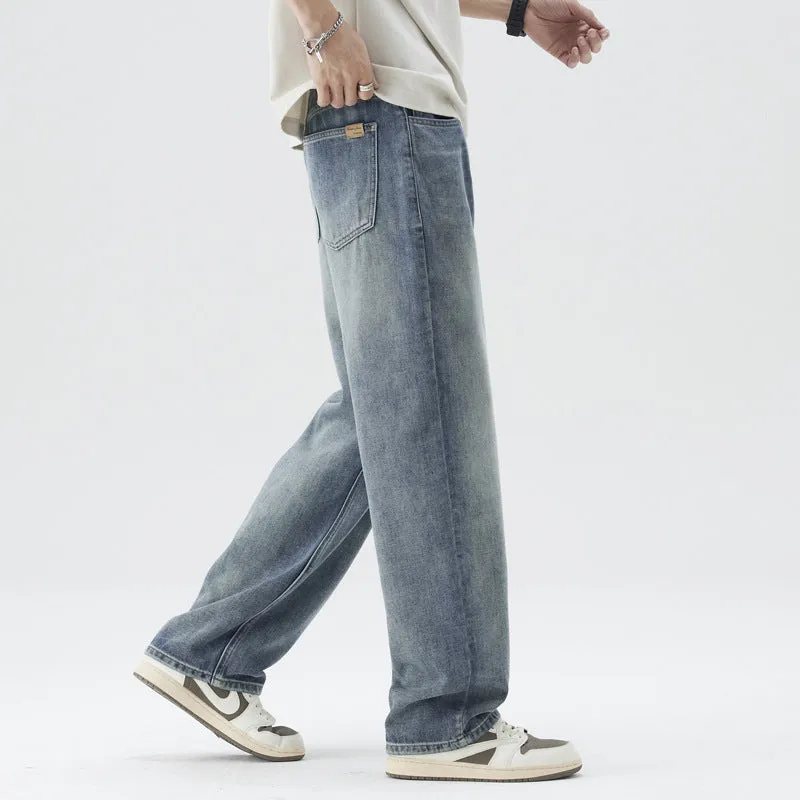 Retro straight-leg jeans for men in light blue cotton denim on a neutral background.