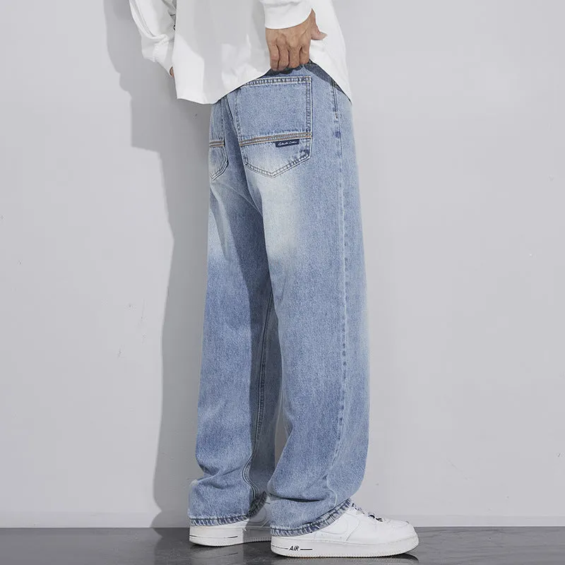 Retro straight-leg jeans for men in light blue cotton denim on a neutral background.