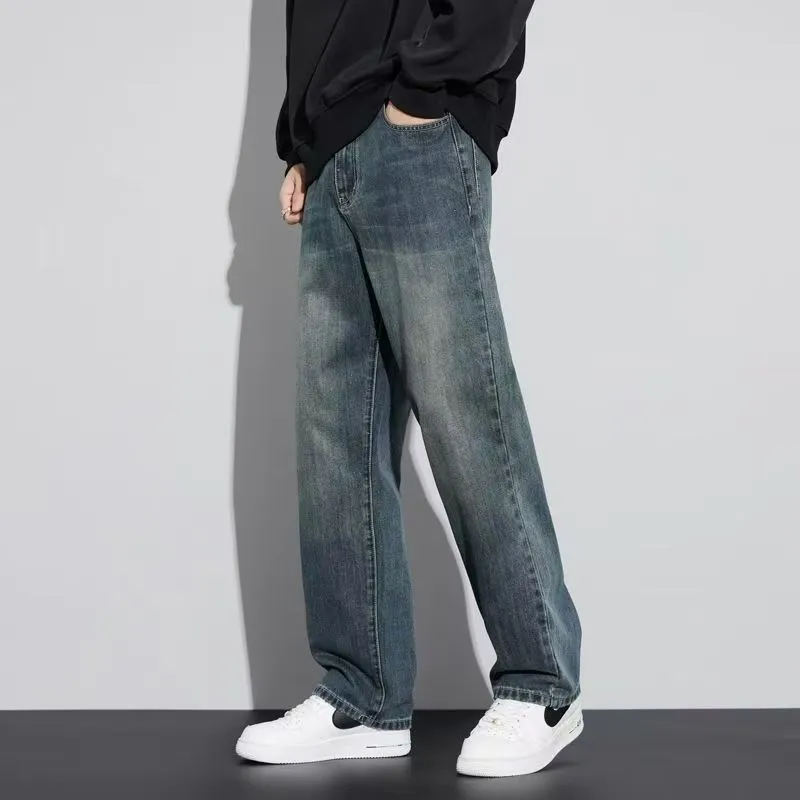 Retro straight-leg jeans for men in light blue cotton denim on a neutral background.