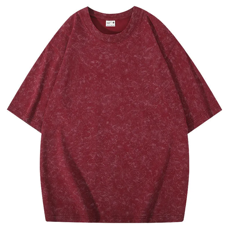 Loose-fit pure cotton batik distressed t-shirt in a solid colour, showing round neck and washed finish.