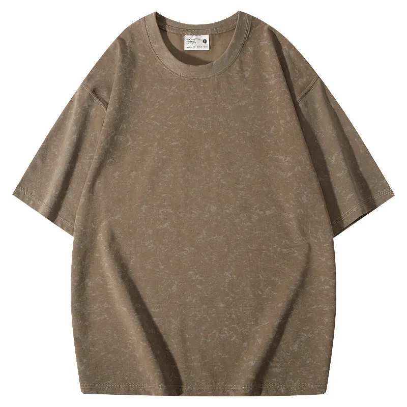 Loose-fit pure cotton batik distressed t-shirt in a solid colour, showing round neck and washed finish.