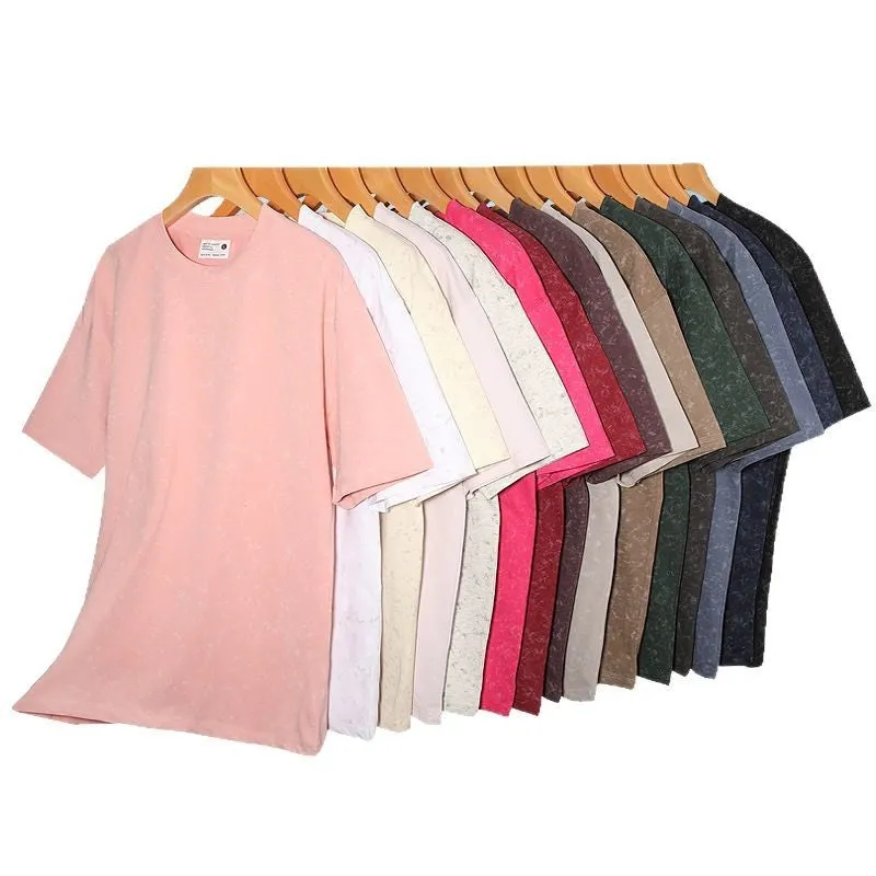 Loose-fit pure cotton batik distressed t-shirt in a solid colour, showing round neck and washed finish.