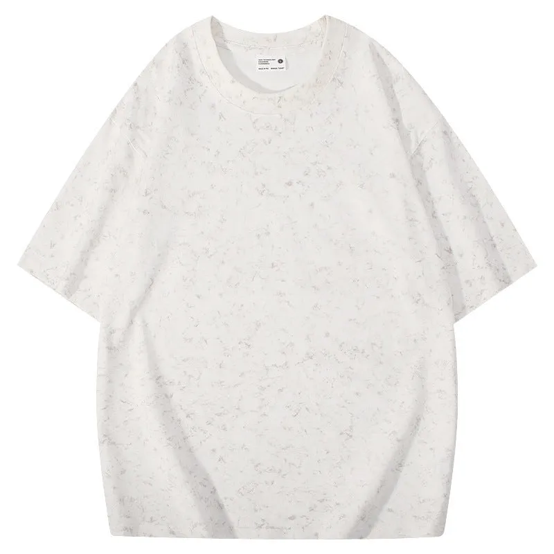 Loose-fit pure cotton batik distressed t-shirt in a solid colour, showing round neck and washed finish.