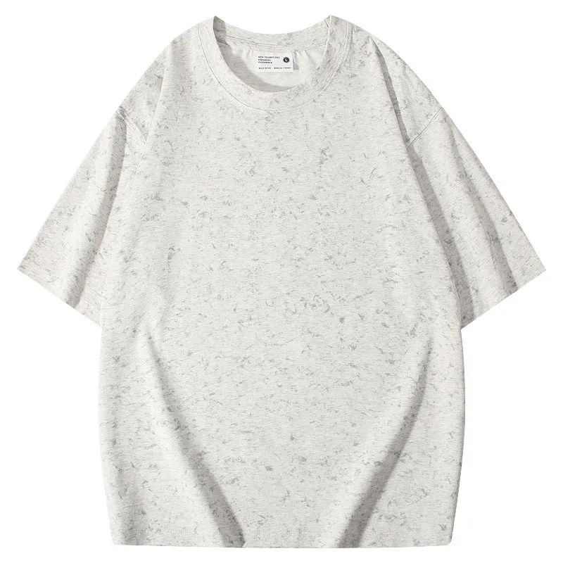 Loose-fit pure cotton batik distressed t-shirt in a solid colour, showing round neck and washed finish.