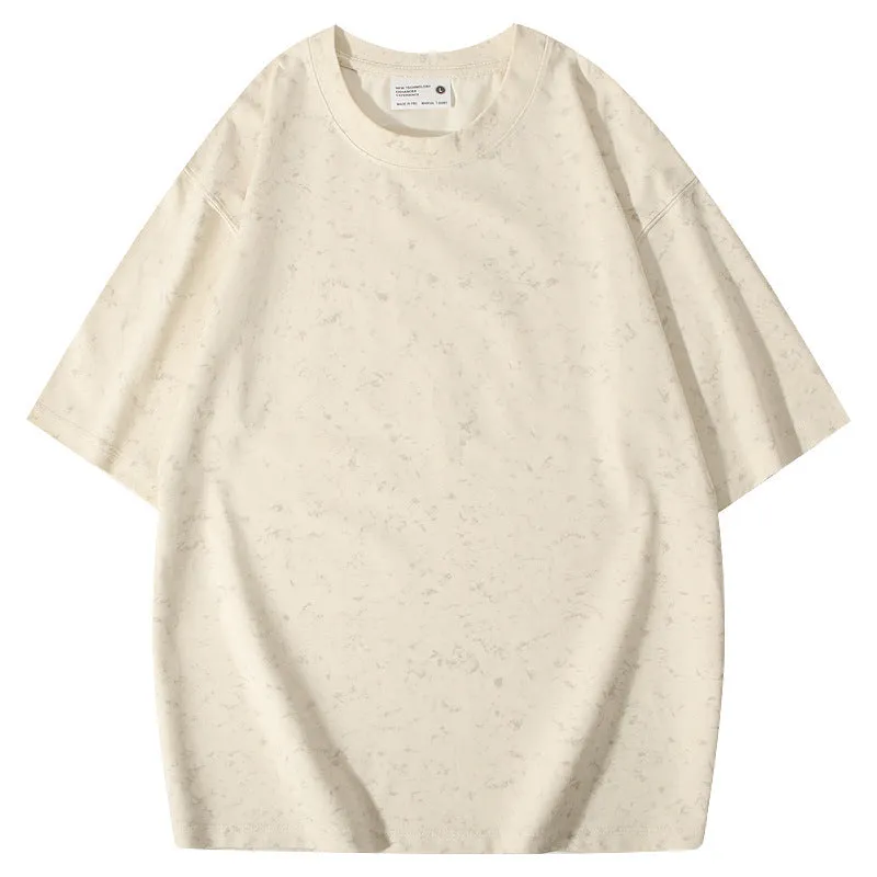 Loose-fit pure cotton batik distressed t-shirt in a solid colour, showing round neck and washed finish.