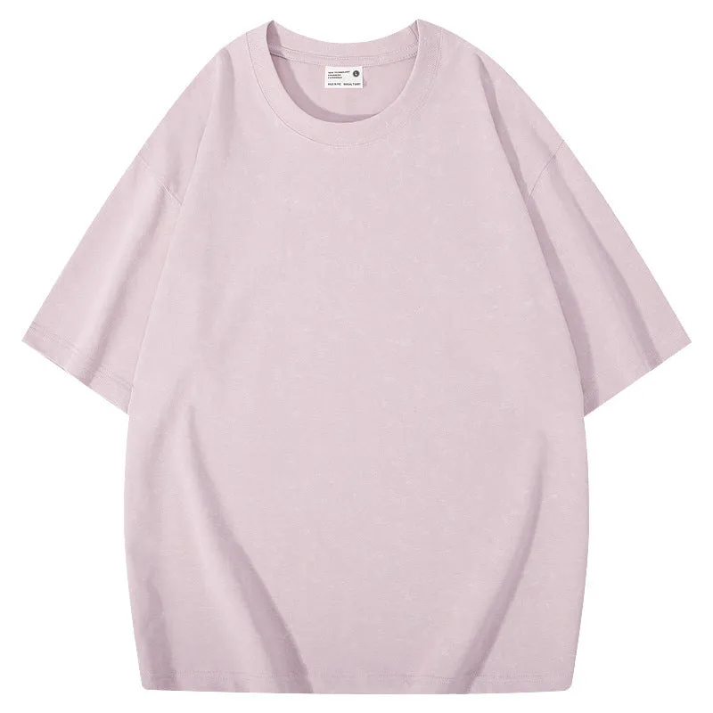 Loose-fit pure cotton batik distressed t-shirt in a solid colour, showing round neck and washed finish.