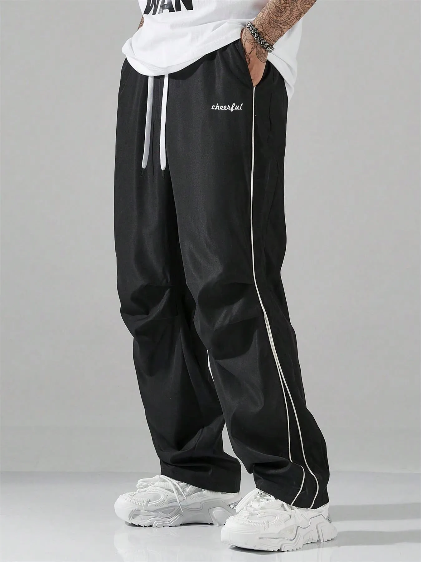 European high street charging paratrooper pants for teenagers, straight-leg acrylic blend trousers, elastic drawstring waist, side view