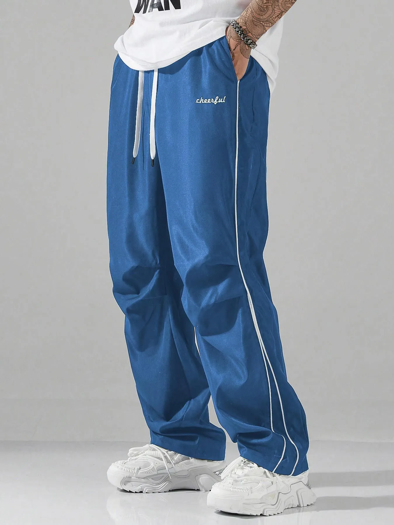 European high street charging paratrooper pants for teenagers, straight-leg acrylic blend trousers, elastic drawstring waist, side view