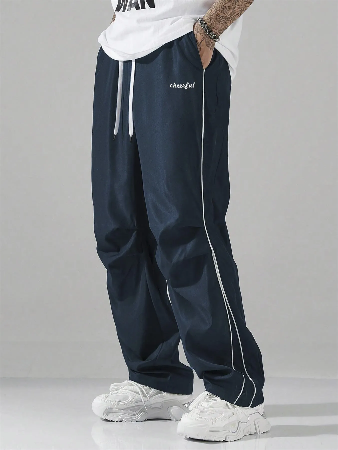 European high street charging paratrooper pants for teenagers, straight-leg acrylic blend trousers, elastic drawstring waist, side view